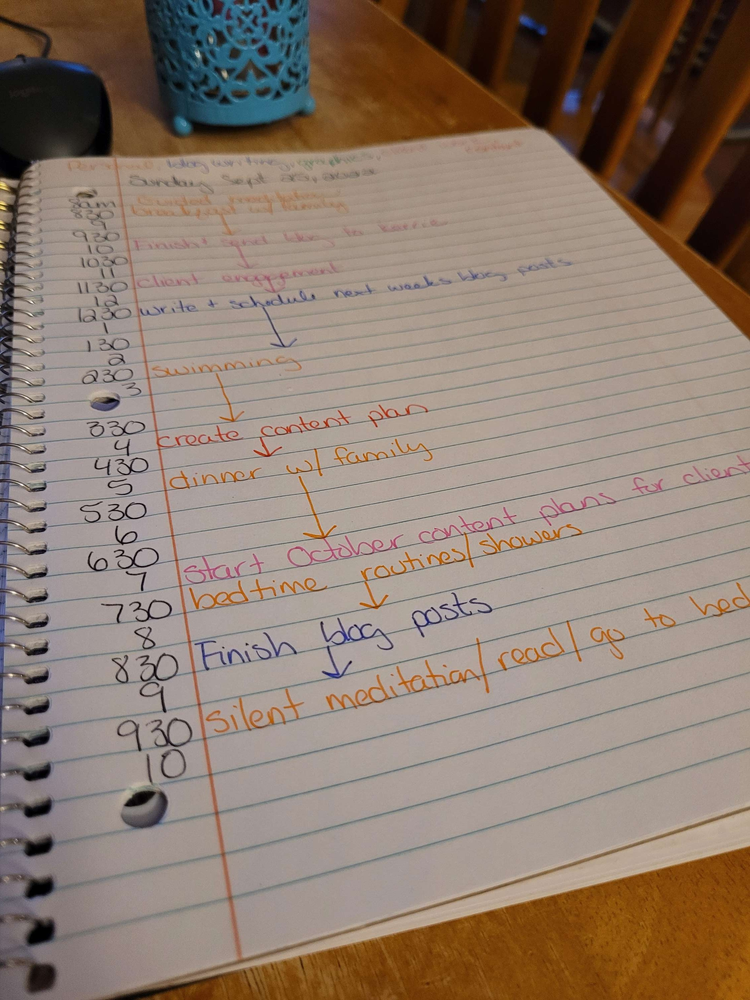 Creating a daily plan using a notebook.